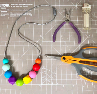 Timelapse Video of the Creation of a Rainbow Teething Necklace