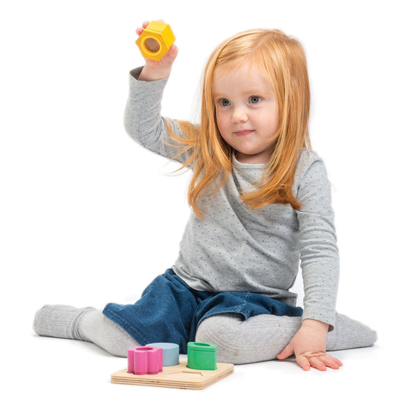 Girl Playing With Visual Sensory Tray Toy