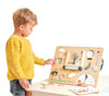Boy playing with wooden weather board